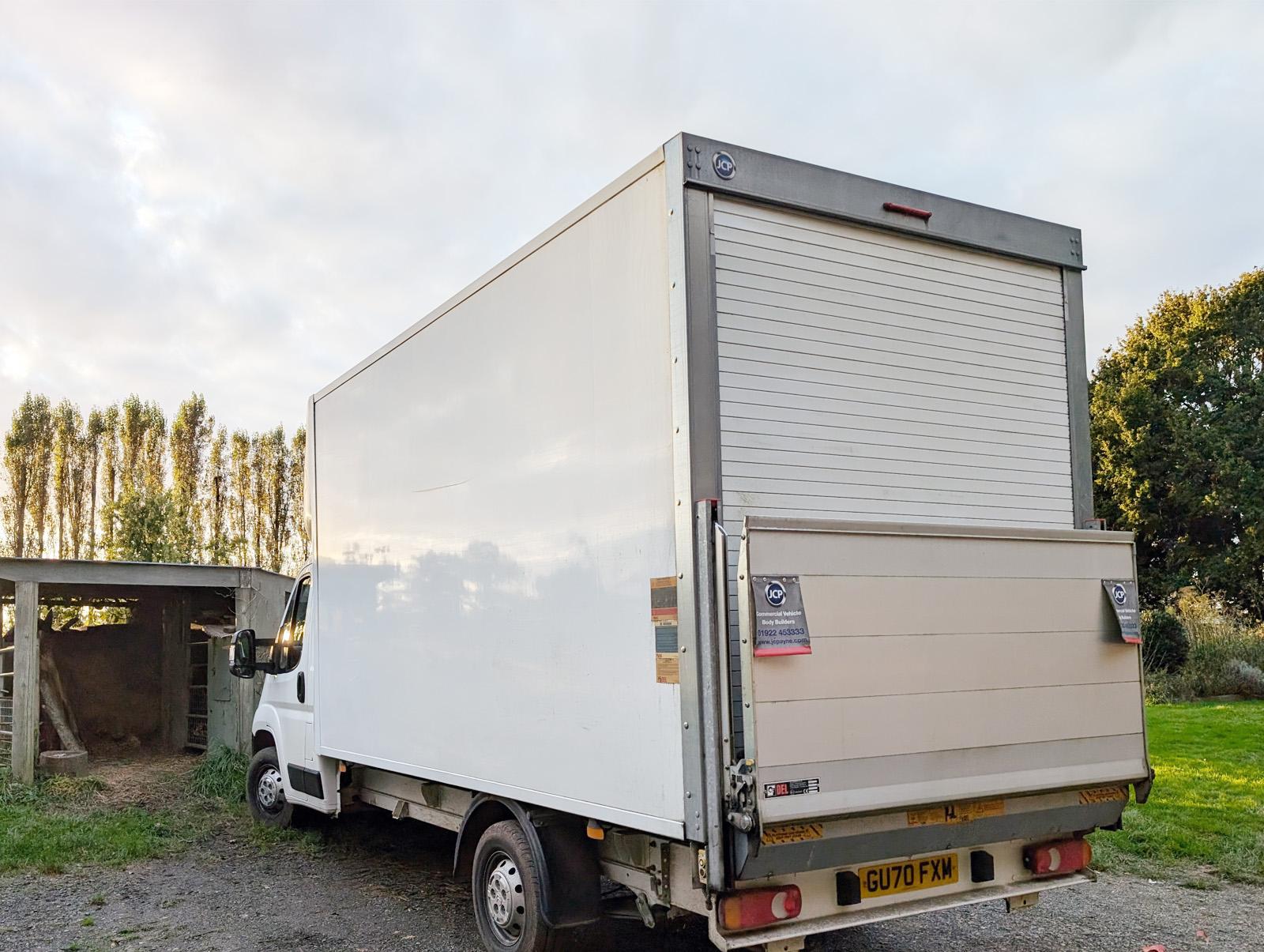 Large white van with driver